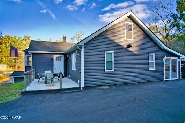 back of property with a patio