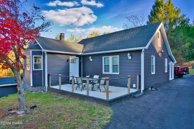 rear view of house with a patio