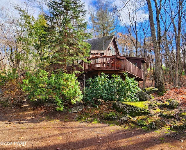 view of side of property featuring a deck