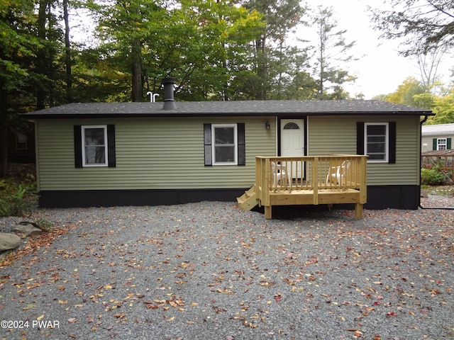 view of front facade with a wooden deck