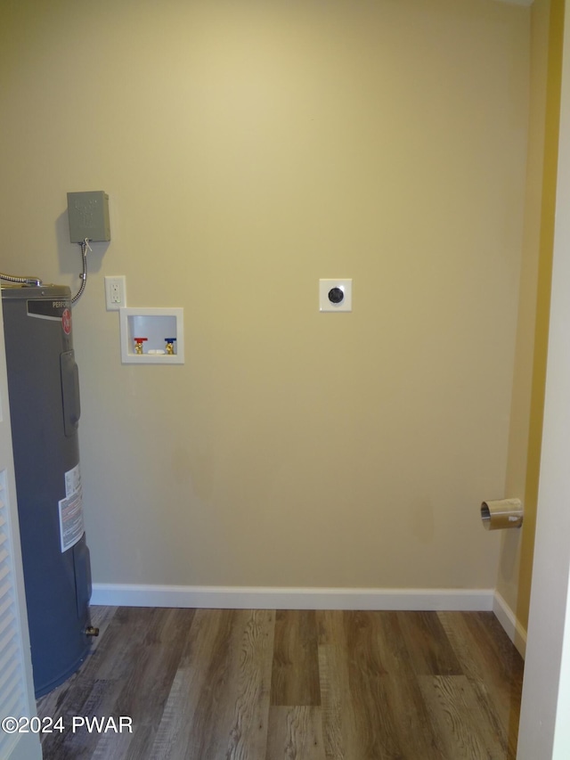 washroom featuring laundry area, wood finished floors, hookup for an electric dryer, water heater, and washer hookup