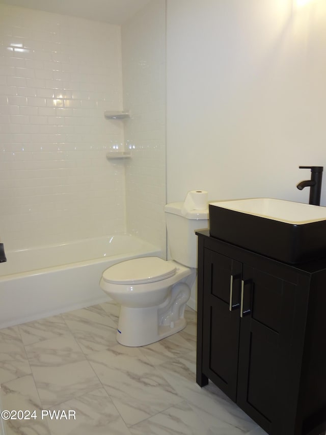 full bathroom featuring toilet, marble finish floor, and vanity