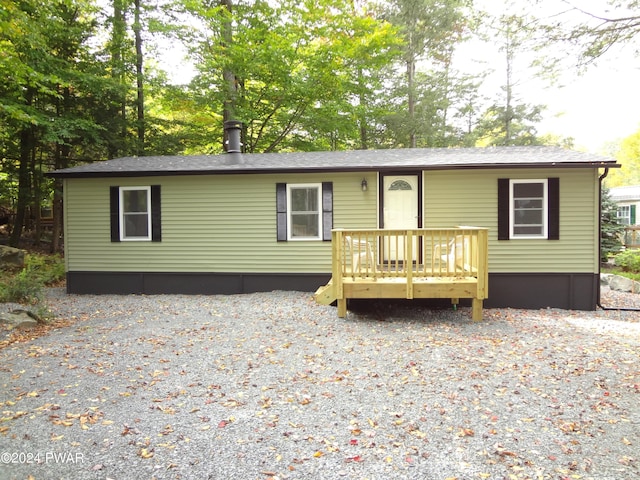 view of front facade featuring a wooden deck