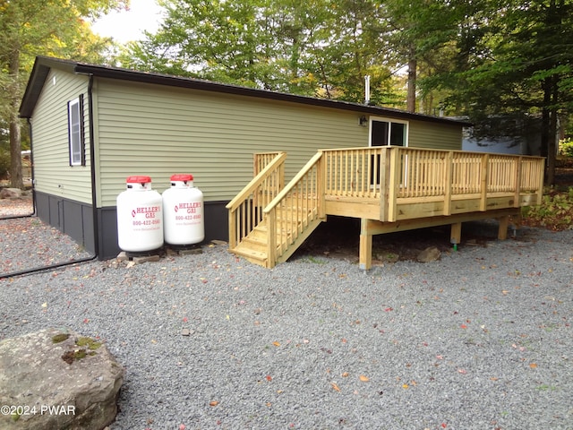 view of front facade with a wooden deck