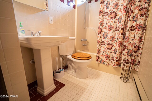 bathroom featuring tile patterned floors, toilet, shower / bathtub combination with curtain, baseboard heating, and tile walls