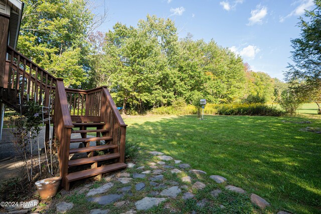 view of yard with a wooden deck