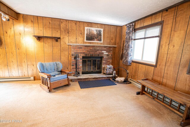 living room featuring carpet flooring, baseboard heating, a fireplace, and wooden walls