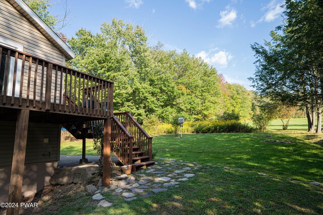 view of yard featuring a wooden deck