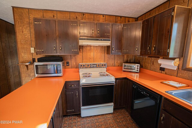 kitchen featuring wood walls, sink, black dishwasher, a textured ceiling, and electric range oven