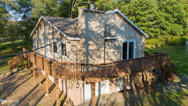 view of property exterior with a yard and a deck