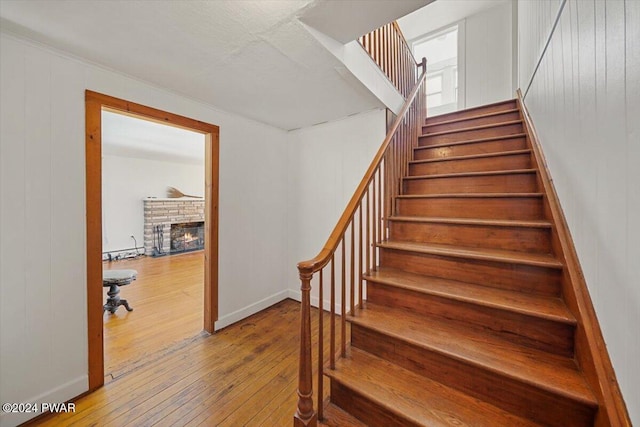 stairs featuring hardwood / wood-style flooring