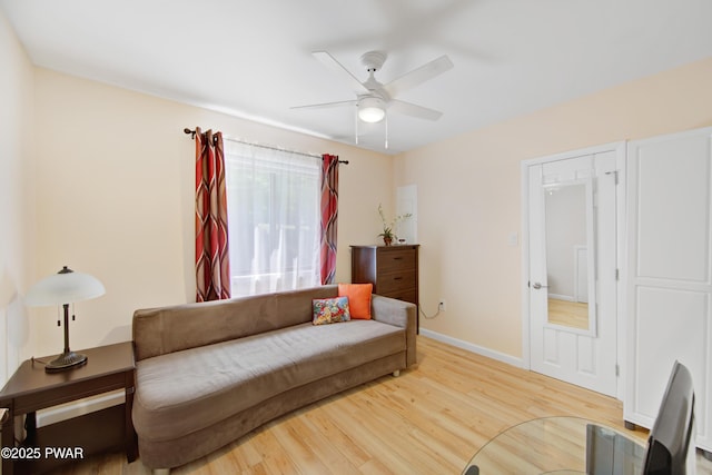 116 Rainbow Dr, Lackawaxen, PA 18435 - living area featuring a ceiling fan, wood finished floors, and baseboards