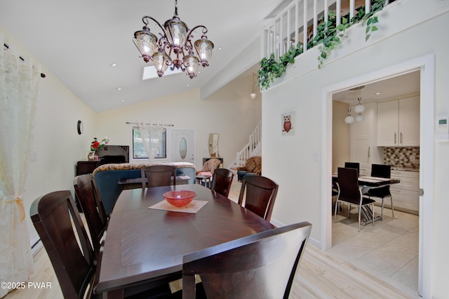 116 Rainbow Dr, Lackawaxen, PA 18435 - dining room with stairs, vaulted ceiling, a chandelier, light wood-style flooring, and recessed lighting