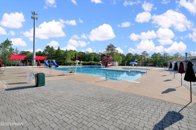 116 Rainbow Dr, Lackawaxen, PA 18435 - community pool with a water slide and a patio area