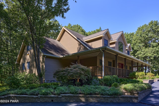 view of home's exterior with covered porch