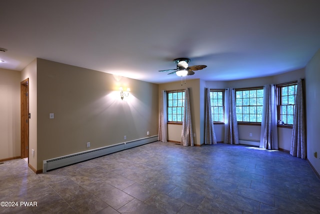 spare room with a baseboard radiator and ceiling fan