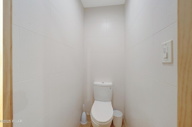 380 Falling Waters Blvd, Lackawaxen, PA 18435 - bathroom featuring toilet and tile walls