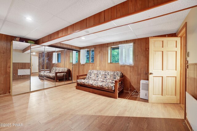 380 Falling Waters Blvd, Lackawaxen, PA 18435 - sitting room with wooden walls, wood finished floors, and a paneled ceiling