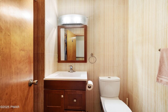 380 Falling Waters Blvd, Lackawaxen, PA 18435 - bathroom featuring tile walls, vanity, and toilet