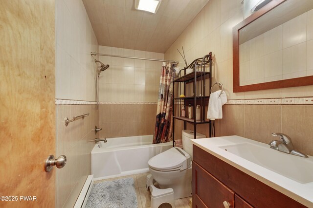 380 Falling Waters Blvd, Lackawaxen, PA 18435 - full bathroom with tile walls, shower / bathtub combination with curtain, a baseboard heating unit, toilet, and vanity