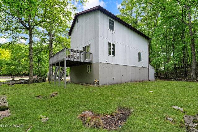 380 Falling Waters Blvd, Lackawaxen, PA 18435 - view of home's exterior with a wooden deck and a lawn