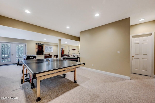 rec room featuring recessed lighting, light carpet, and baseboards