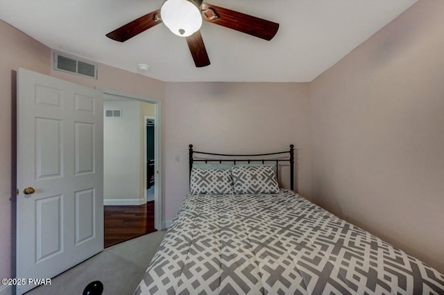 bedroom with a ceiling fan, visible vents, and carpet flooring