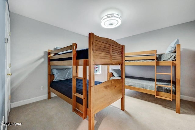 carpeted bedroom with baseboards