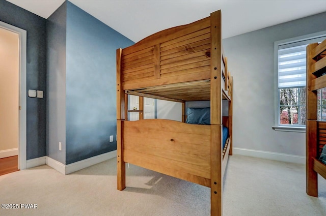 bedroom with carpet floors and baseboards