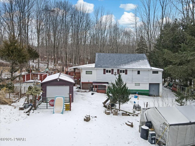 view of front of home with an outbuilding and a garage