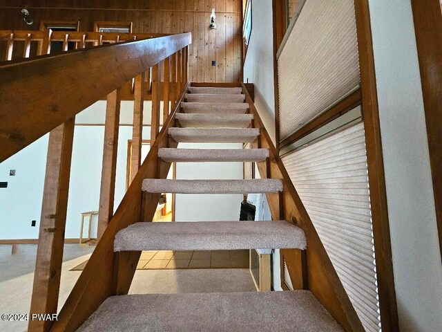 staircase with wooden walls