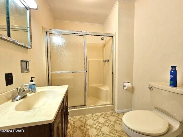 bathroom featuring toilet, a shower with door, vanity, and ornamental molding