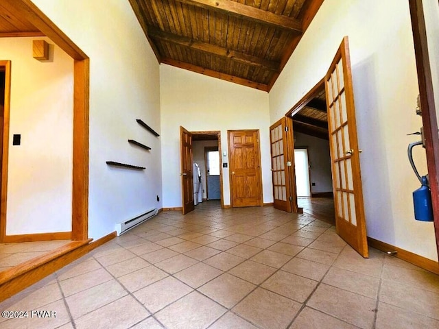 interior space featuring french doors, wood ceiling, a baseboard heating unit, light tile patterned floors, and beamed ceiling