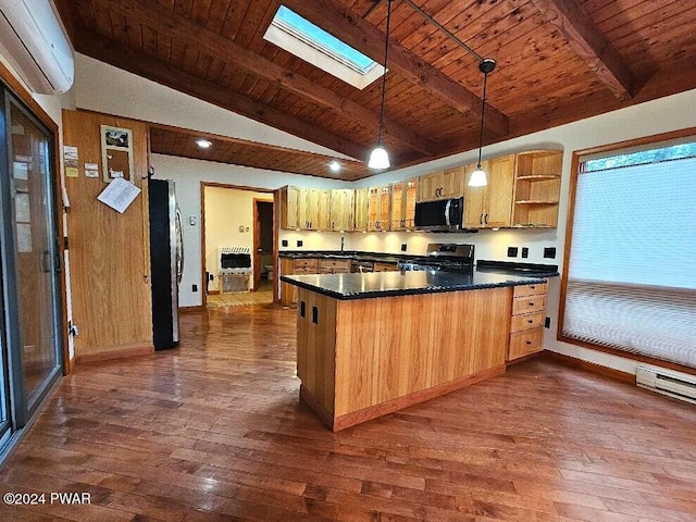 kitchen featuring stainless steel appliances, dark hardwood / wood-style floors, a wall mounted AC, pendant lighting, and vaulted ceiling with skylight