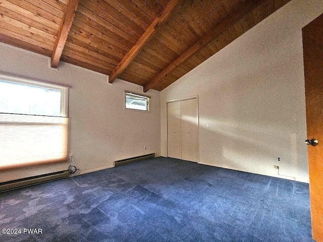 carpeted empty room featuring vaulted ceiling with beams, a baseboard radiator, a wealth of natural light, and wood ceiling