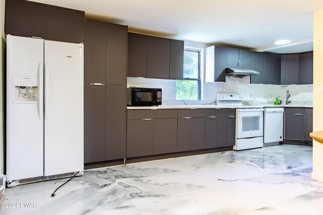 kitchen with white appliances and sink