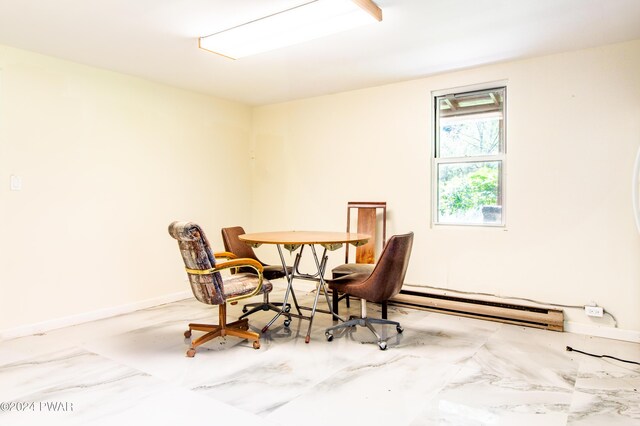 dining room with a baseboard heating unit