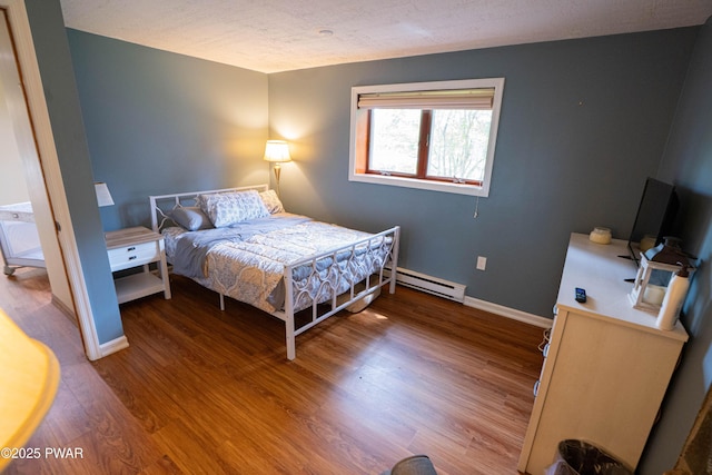 28 Woodcrest Ln, Lake Ariel, PA 18436 - bedroom with a baseboard radiator and wood finished floors