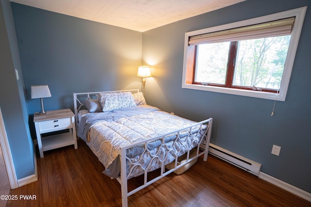 28 Woodcrest Ln, Lake Ariel, PA 18436 - bedroom with baseboard heating and wood finished floors