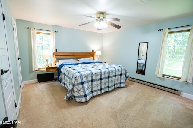 28 Woodcrest Ln, Lake Ariel, PA 18436 - bedroom featuring a baseboard heating unit, multiple windows, and carpet floors