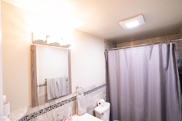 28 Woodcrest Ln, Lake Ariel, PA 18436 - bathroom with a shower with curtain, vanity, and tile walls