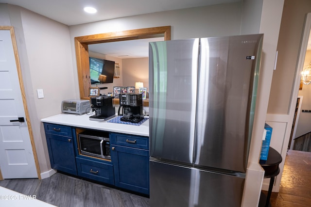 28 Woodcrest Ln, Lake Ariel, PA 18436 - kitchen featuring appliances with stainless steel finishes, blue cabinetry, dark wood-type flooring, light countertops, and recessed lighting