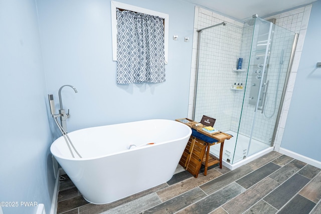 28 Woodcrest Ln, Lake Ariel, PA 18436 - full bath with a shower stall, a soaking tub, and wood tiled floors