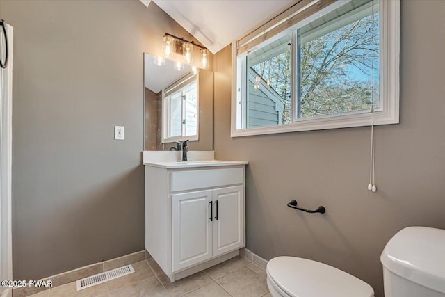 134 Laurel Hill Dr Unit 102, Greentown, PA 18426 - bathroom with tile patterned flooring, visible vents, toilet, lofted ceiling, and baseboards