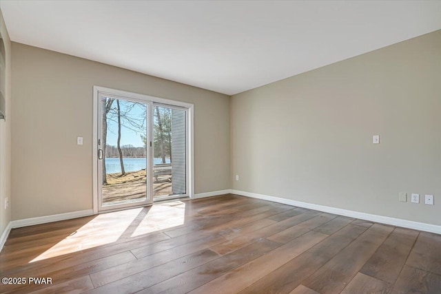134 Laurel Hill Dr Unit 102, Greentown, PA 18426 - unfurnished room with hardwood / wood-style floors, baseboards, and a water view