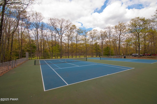 134 Laurel Hill Dr Unit 102, Greentown, PA 18426 - view of tennis court with community basketball court, a view of trees, and fence