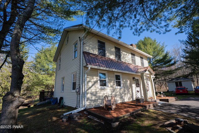 477 Purdytown Tpke, Lakeville, PA 18438 - view of front of house featuring metal roof and a chimney