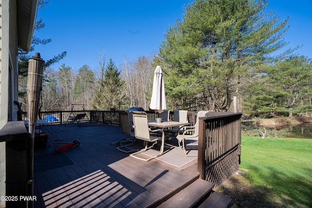 477 Purdytown Tpke, Lakeville, PA 18438 - deck featuring outdoor dining space and a lawn