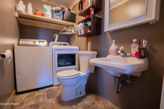 477 Purdytown Tpke, Lakeville, PA 18438 - clothes washing area with washing machine and dryer and laundry area