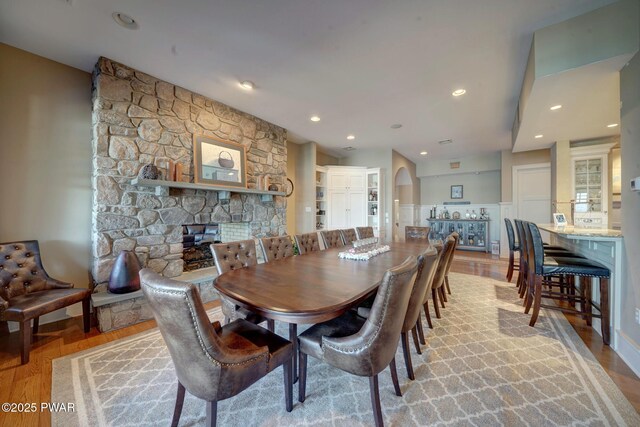 130 Calico Ct, Paupack, PA 18451 - dining area with recessed lighting, wainscoting, a fireplace, and light wood finished floors